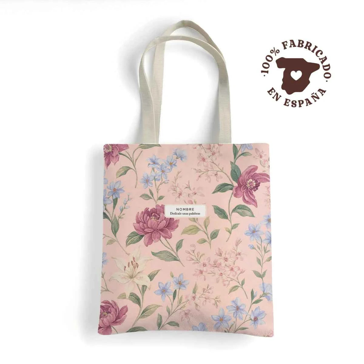 Tote bag resistente con estampado floral Pink Lady en tonos rosados sobre fondo rosa suave. Fabricada en España y personalizable.