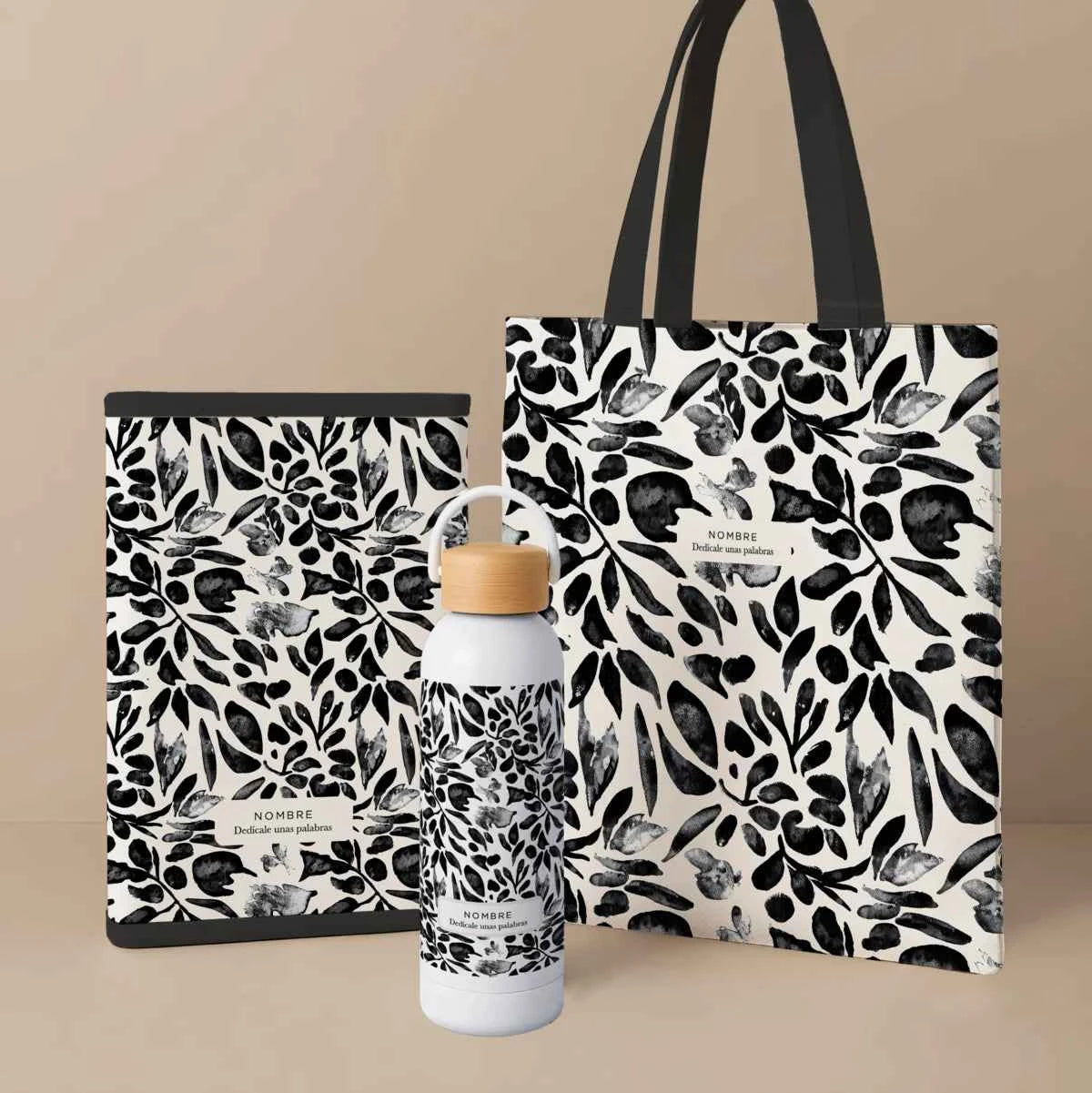 Pack con tote bag, portadocumentos acolchado y bidón térmico en estampado Floral Negro elegante. Fabricado en España y personalizable.