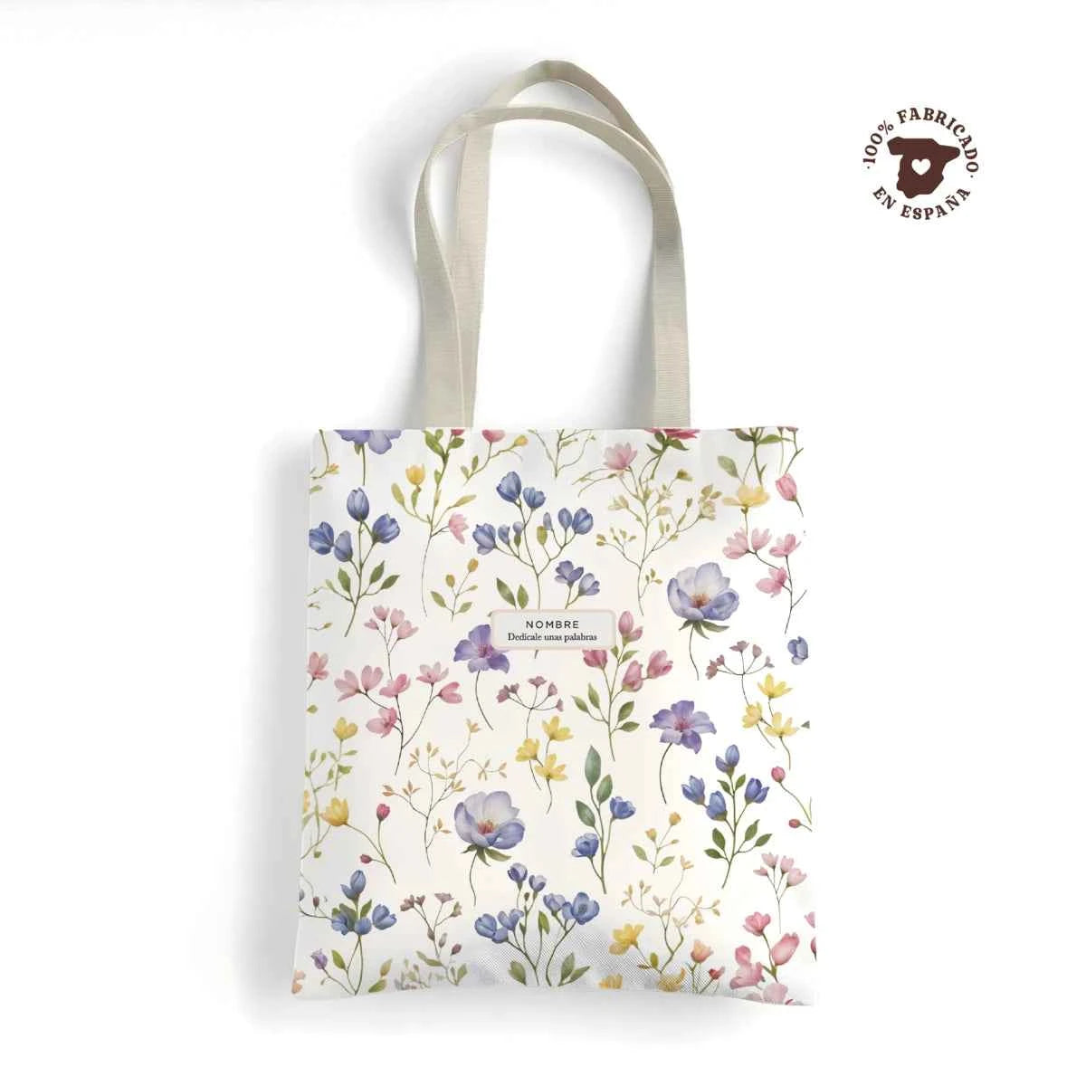 Tote bag resistente fabricada en España con estampado floral Violetas en tonos lila y rosa. Personalizable.