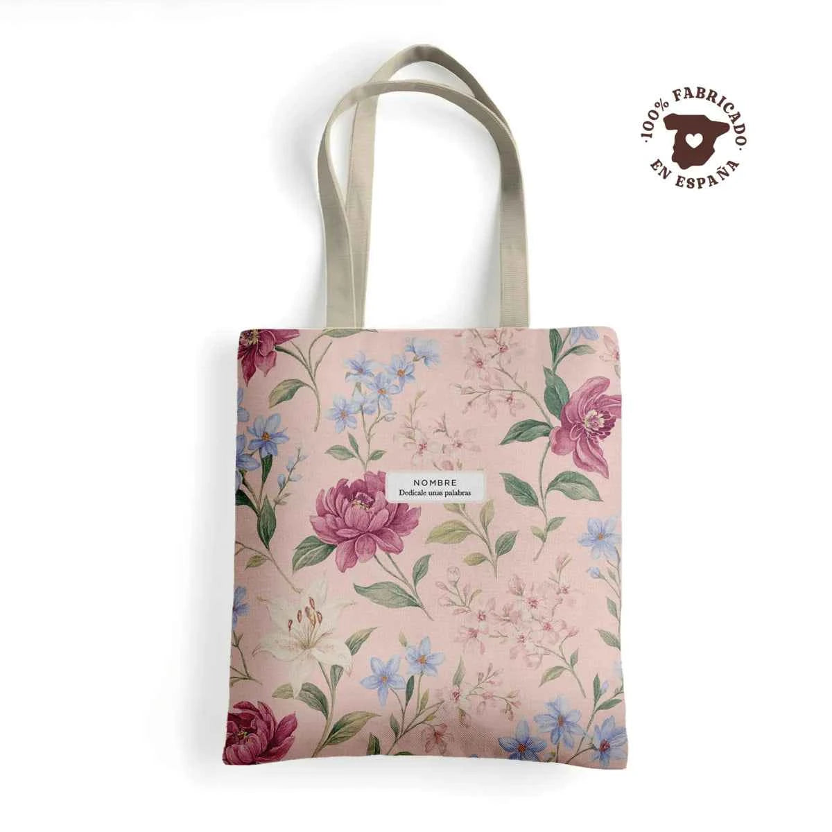 Tote bag de loneta con estampado floral Pink Lady en tonos rosa empolvado, lila y azul, personalizada con nombre. Fabricado en España