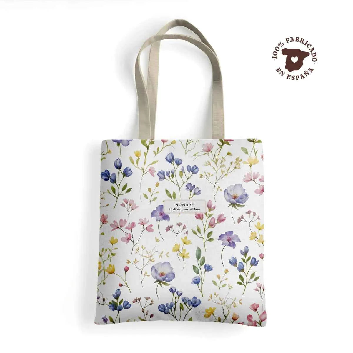Tote bag de loneta fabricada 100% en España con estampado floral Violetas en tonos pastel y acuarela, personalizada con nombre.