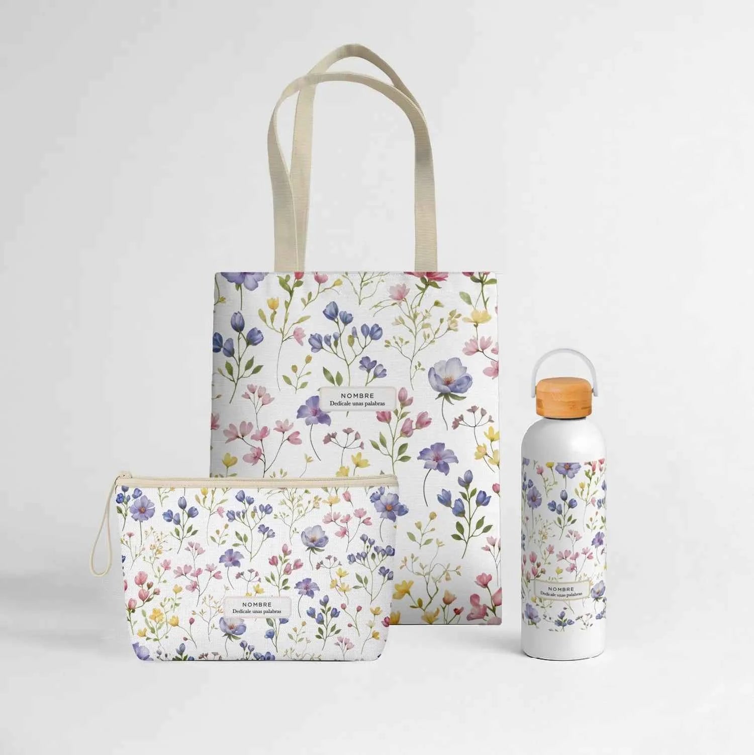 Wonder Pack Violetas personalizado con tote bag, neceser y bidón térmico de 500 ml, con estampado floral acuarela en violetas, rosas y azules.